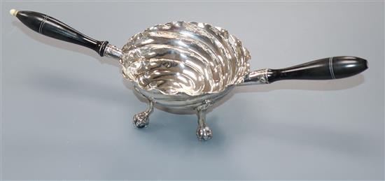 A Continental white metal two handled spiral decorated tasting bowl, on claw and ball feet, overall width 28.8cm.